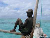 sailor on relaxing on his dhow